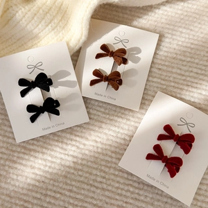 Three pairs of elegant velvet bow hair clips in black, brown, and wine red colors