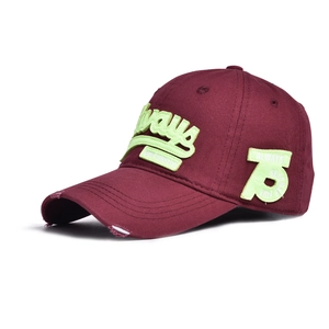 Detail of distressed burgundy baseball cap with neon green Always embroidery