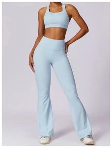 Detail view of light blue yoga set with high-waist flared pants and slim fit sports bra