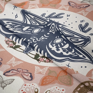Detailed view of bohemian mandala tapestry featuring blue wolf and floral textile texture