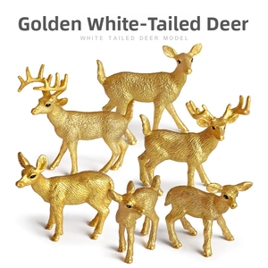 Macro shot of 7 golden white-tailed deer figurines with detailed texture carvings