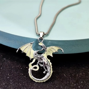 Luminous dragon necklace in silver metal with green glow wings for fantasy jewelry lovers