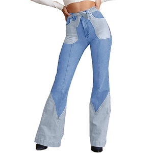 Detail of high-waist flare jeans with dark and light blue patchwork and matching waist tie