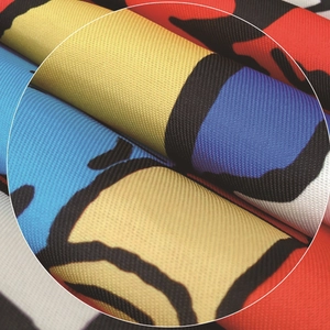 Detailed macro view of the fabric texture and colorful cartoon prints on the apron