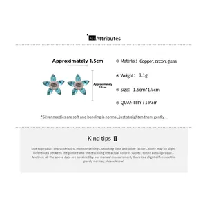 Detail showing dimensions of blue star zircon earrings with silver needle and S logo