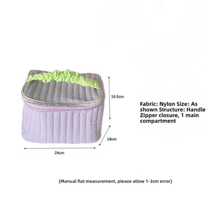 Detailed view of quilted nylon makeup bag dimensions 24cm x 18cm x 16.5cm in lilac purple