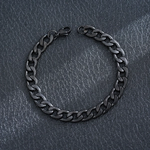 Detailed view of a sleek black cuban link bracelet made of durable stainless steel.