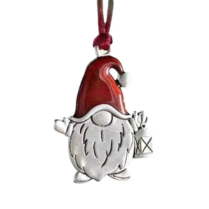 Silver metal Christmas gnome hanging ornament with red hat and lantern detail