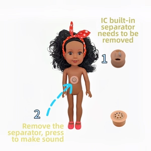Detail view of the sound device component on a deep skin tone baby doll toy