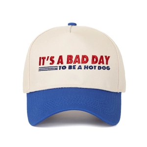 Detail of contrast embroidery text IT'S A BAD DAY TO BE A HOTDOG on baseball cap crown