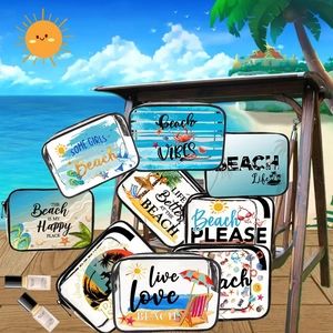 Transparent PVC beach cosmetic bags with travel phrases on a wooden sun lounger