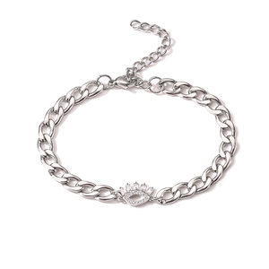 Silver stainless steel curb chain bracelet featuring a zircon pavé evil eye charm