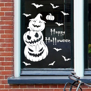 White vinyl window decal featuring Happy Halloween pumpkins and bats on a glass surface