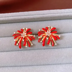 Vintage style red enamel flower earrings with white zircon crystals in a gold setting