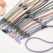 Detailed macro view of colorful suede phone lanyards with metal clips and secure patches