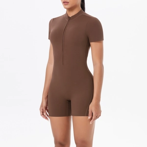 Close-up of brown athletic bodysuit featuring a front zipper and high elastic fabric