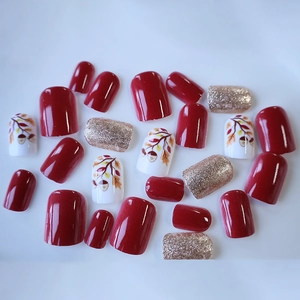Short square press-on nails with autumn maple leaf, acorn art and red glitter finish