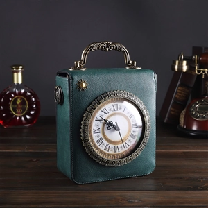 Vintage green clock shaped handbag with Roman numerals on a dark wood surface