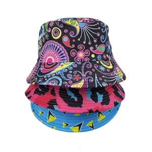 Detailed view of three fisherman hats with paisley, leopard print, and geometric patterns