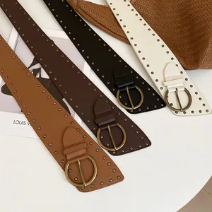Vintage leather rivet belts with circular buckles in camel, brown, black, and white colors