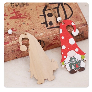 Close-up of wooden gnome ornaments with polka dot hats and rustic hanging twine details