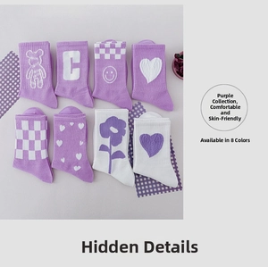 Detail of assorted purple cotton crew socks featuring cute cartoon patterns and patterns