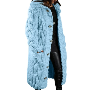 Detail of light blue cable knit pattern and large buttons on long hooded cardigan
