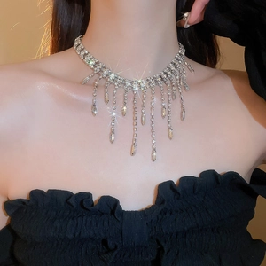 Detail of silver choker featuring multi-layered rhinestones and elegant fringe tassels