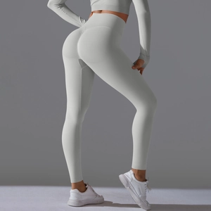 Close-up of high-waisted seamless scrunch butt yoga pants in light grey knit fabric