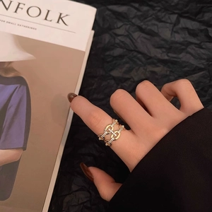 Detail of gold double-layer chain ring with micro-pave cubic zirconia on model