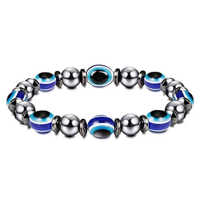 Detailed close-up of an elastic Evil Eye bracelet with blue beads and polished hematite