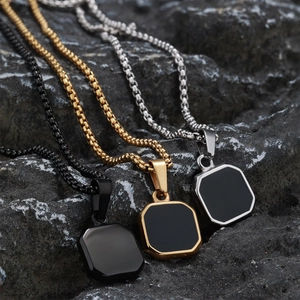 Octagonal square pendant necklaces with black inlay on rough natural stone background