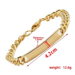 Detail of gold Cuban link bracelet with 4.2cm polished blank ID tag for custom engraving