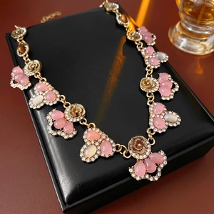Vintage floral necklace with pink teardrop stones and crystals on black leather base
