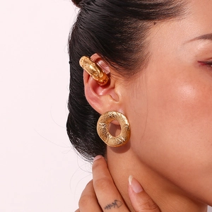 Close-up of 18K gold-plated hoop earrings and ear cuff with hammered metal texture