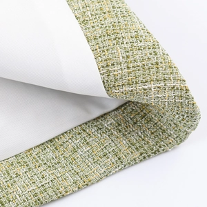 Women's green tweed jacket featuring waist-cinching cut and premium woven texture