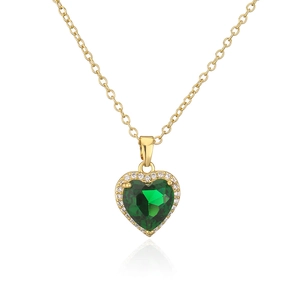 Detail of 18K gold plated heart pendant with green gemstone and zircon accents