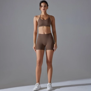 Front view of brown seamless yoga set with sports bra and high-waisted shorts