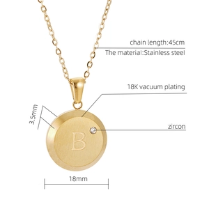 Detailed view of 18K gold plated coin pendant with letter B and small zircon stone