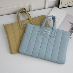 Minimalist quilted laptop bag for iPad Pro with waterproof nylon in blue and khaki colors
