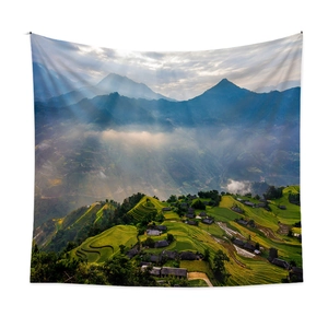 Bohemian style tapestry featuring a foggy mountain landscape with terraced rice fields
