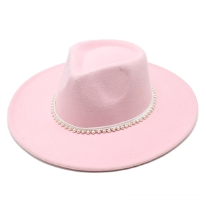 Close-up of pink wool fedora hat crown featuring elegant pearl bead strand decoration