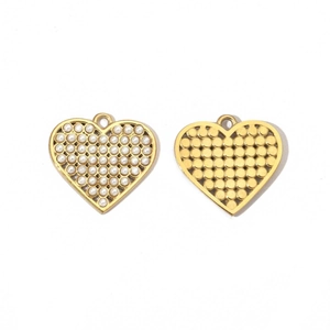 Close-up of gold heart wing lock pendants with pearl inlay for DIY jewelry making