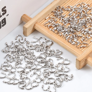 Macro shot of silver stainless steel U-shaped wire guards for jewelry DIY crafting