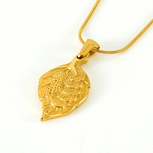 Polished gold leaf pendant necklace with coin engraving on a sleek snake chain