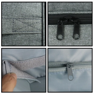 Detail of grey fabric nail polish bag showing dual zippers and Velcro strap