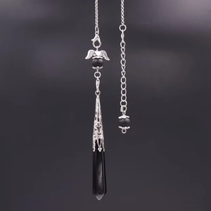 Gothic angel wing pendant necklace with black hexagonal crystal and silver filigree detail