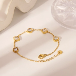 Detail of 18K gold-plated stainless steel bracelet with heart and square zircon stones
