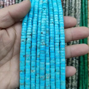Detailed close-up of sky blue turquoise cylinder beads with natural brown vein textures