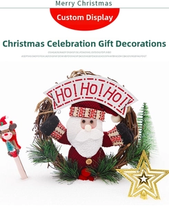 Close-up of a festive rattan wreath featuring a knitted Santa Claus and HO HO HO sign